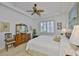 Comfortable bedroom offers natural light, ceiling fan, and spacious layout at 2292 Sifield Greens Way # 59, Sun City Center, FL 33573