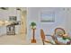 Bright dining area with stainless steel appliances, granite countertops, and cozy table with fruit bowl at 2292 Sifield Greens Way # 59, Sun City Center, FL 33573