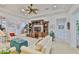 Open-concept living room features view to kitchen and decorative built-in at 2292 Sifield Greens Way # 59, Sun City Center, FL 33573