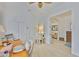 Bright office space featuring light hardwood floors, white walls, and a view into the living room at 2292 Sifield Greens Way # 59, Sun City Center, FL 33573