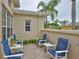 Inviting outdoor patio with comfortable seating, perfect for relaxing or entertaining guests at 2292 Sifield Greens Way # 59, Sun City Center, FL 33573