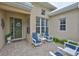 Inviting outdoor patio with comfortable seating, perfect for relaxing or entertaining guests at 2292 Sifield Greens Way # 59, Sun City Center, FL 33573