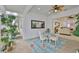 Cozy sunroom boasts natural light, a glass table, and view of other rooms at 2292 Sifield Greens Way # 59, Sun City Center, FL 33573