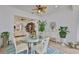 Sunroom with natural light and glass table, offering tranquil views into the home at 2292 Sifield Greens Way # 59, Sun City Center, FL 33573