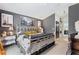 Nicely decorated bedroom with gray walls, unique artwork, and a charming white iron bed at 2359 Emerald Lake Dr, Sun City Center, FL 33573