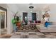 Stylish living room featuring tile floors, comfortable seating, and unique decor at 2359 Emerald Lake Dr, Sun City Center, FL 33573