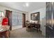 Home office featuring a wood desk, gray carpeting, a framed painting, and plenty of natural light at 2359 Emerald Lake Dr, Sun City Center, FL 33573