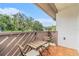 Cozy balcony with outdoor seating, offering a serene space to relax and enjoy the surrounding landscape at 2368 Flanders Way # D, Safety Harbor, FL 34695