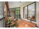 Relaxing screened balcony with tile flooring and an open view to the outside at 2368 Flanders Way # D, Safety Harbor, FL 34695