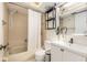 Classic bathroom design with a shower and tub combination, a modern sink, and well-maintained fixtures at 2368 Flanders Way # D, Safety Harbor, FL 34695