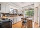 Bright kitchen featuring white cabinets, wood countertops, stainless steel appliances, and eat-in dining at 2368 Flanders Way # D, Safety Harbor, FL 34695