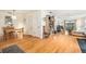 Open living room with hardwood floors flowing into the dining area at 2368 Flanders Way # D, Safety Harbor, FL 34695
