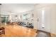 Bright living room features light colored hardwood floors and natural light at 2368 Flanders Way # D, Safety Harbor, FL 34695