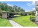 Assigned parking area with mature trees and green landscape at 2368 Flanders Way # D, Safety Harbor, FL 34695