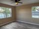 Bedroom featuring wood floors and natural light from multiple windows at 2404 Cassell St, Tampa, FL 33605