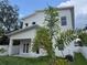 Back exterior showing patio and white privacy fence at 2404 Cassell St, Tampa, FL 33605