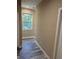 Hallway with wood floors and natural light at 2404 Cassell St, Tampa, FL 33605