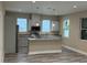Bright kitchen with island, stainless appliances, and white cabinets offering modern appeal at 2404 Cassell St, Tampa, FL 33605