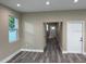 A view of the living room with modern floors and neutral paint at 2404 Cassell St, Tampa, FL 33605
