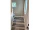 Staircase with vinyl flooring and natural light from nearby windows at 2404 Cassell St, Tampa, FL 33605