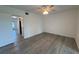 This bedroom features wood-look floors, a ceiling fan, and a neutral color palette at 2459 Columbia Dr # 39, Clearwater, FL 33763