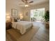 Bedroom with decor, fan and view of bonus room with lots of natural light at 2459 Columbia Dr # 39, Clearwater, FL 33763