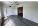 This bedroom has wood-look floors and a large closet for storage space at 2459 Columbia Dr # 39, Clearwater, FL 33763