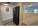 Bright kitchen features stainless steel refrigerator, wood look floors and ample storage at 2459 Columbia Dr # 39, Clearwater, FL 33763