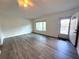 Bright, open living area with sleek floors, a large window view, and a welcoming front door at 2459 Columbia Dr # 39, Clearwater, FL 33763