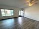 This bright living room features wood-look floors and a large window for natural light at 2459 Columbia Dr # 39, Clearwater, FL 33763