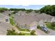 An aerial view of the homes features a well-manicured lawn and brick driveway at 2537 Stanhope Dr, New Port Richey, FL 34655