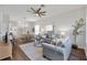 Spacious living room featuring modern decor, wood floors, and open layout perfect for entertaining guests at 2537 Stanhope Dr, New Port Richey, FL 34655