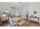 Open-concept living area featuring stylish decor, wood floors, and seamless flow into the dining space at 2537 Stanhope Dr, New Port Richey, FL 34655