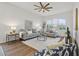 Elegant living room featuring neutral tones, ample seating, and a cozy atmosphere for relaxation at 2537 Stanhope Dr, New Port Richey, FL 34655