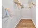 Walk-in closet with wire shelving for storage, providing organization for clothing and accessories at 2537 Stanhope Dr, New Port Richey, FL 34655