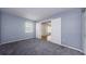 Cozy carpeted bedroom with natural light at 2690 Coral Landings Blvd # 122, Palm Harbor, FL 34684