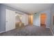Spacious bedroom featuring soft carpet, and ensuite at 2690 Coral Landings Blvd # 122, Palm Harbor, FL 34684