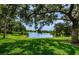 Beautiful lake view surrounded by lush greenery at 2690 Coral Landings Blvd # 122, Palm Harbor, FL 34684