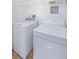 Laundry area featuring a full-size washer and dryer for convenient laundry at 2690 Coral Landings Blvd # 122, Palm Harbor, FL 34684