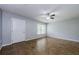 Bright, open living room with tile floors, a ceiling fan, and a large window at 2690 Coral Landings Blvd # 122, Palm Harbor, FL 34684