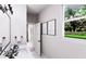 Bright bathroom with modern vanity, decorative art and view to beautiful landscape at 3011 1St N Ave, St Petersburg, FL 33713