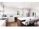 Bright kitchen featuring white cabinets, stainless steel appliances, and a large island with counter seating at 3011 1St N Ave, St Petersburg, FL 33713