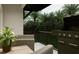 Relaxing patio with a grill and comfortable seating, ideal for outdoor cooking and enjoying the peaceful scenery at 3011 1St N Ave, St Petersburg, FL 33713