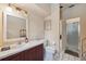 Bathroom features a white vanity with a large mirror and walk-in shower at 3037 Crest Dr, Clearwater, FL 33759