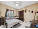 Bedroom with a bed, desk and tile floors with neutral paint and curtains at 3037 Crest Dr, Clearwater, FL 33759