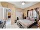 Bedroom with view of a closet and adjacent room, complete with tile flooring at 3037 Crest Dr, Clearwater, FL 33759
