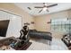 Neutral bedroom with a ceiling fan and an oversized window provides ample natural light at 3037 Crest Dr, Clearwater, FL 33759