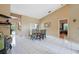 Open dining area with tile floors, high ceilings, and view of the pool at 3037 Crest Dr, Clearwater, FL 33759