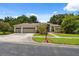 Inviting single-story home with a two-car garage and a meticulously maintained front yard at 3037 Crest Dr, Clearwater, FL 33759