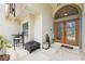 Charming front porch seating area with stylish furniture and a welcoming ambiance at 3037 Crest Dr, Clearwater, FL 33759